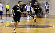 Tight win keeps handballers on title track